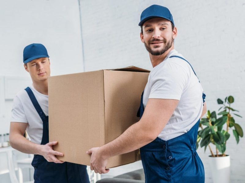 two-handsome-movers-transporting-cardboard-box-in-apartment-e1620131893815.jpg two-handsome-movers-transporting-cardboard-box-in-apartment-e1620131893815.jpg